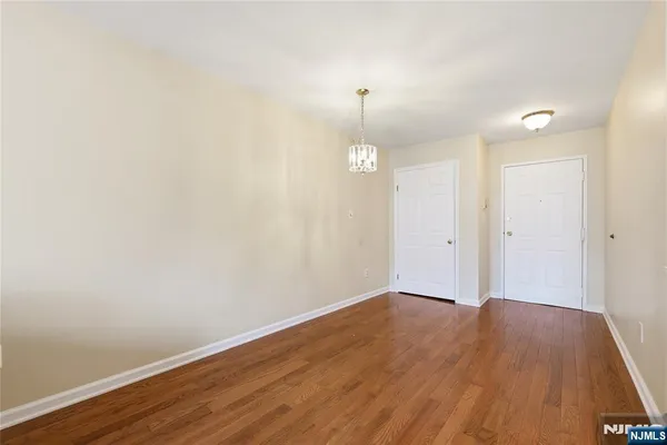 a view of a room with wooden floor and sink