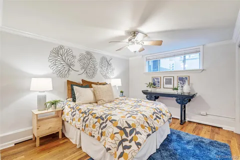 a bedroom with bed and a chandelier