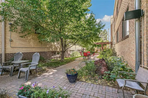 a garden view with a seating space