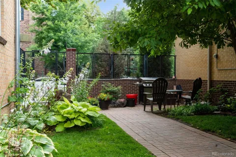 a view of a garden with sitting area