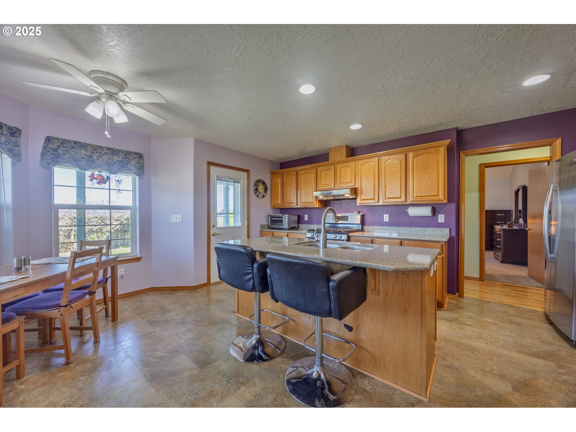 788 Southeast Meadows Loop Sheridan, OR 97378 - Photo 12 of 45 a living room with dining room and wooden floor
