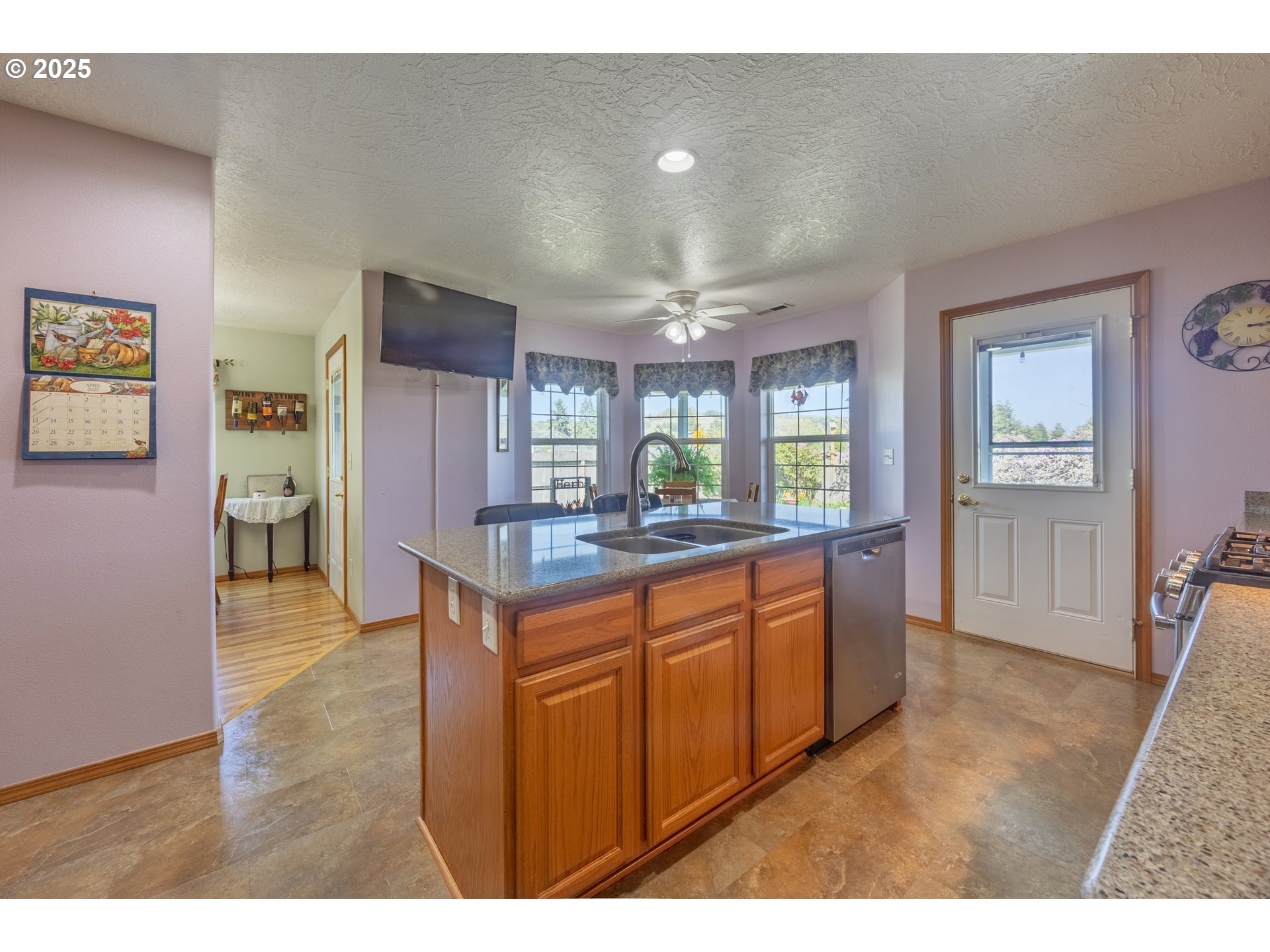 788 Southeast Meadows Loop Sheridan, OR 97378 - Photo 15 of 45 a kitchen with stainless steel appliances granite countertop a refrigerator and a sink