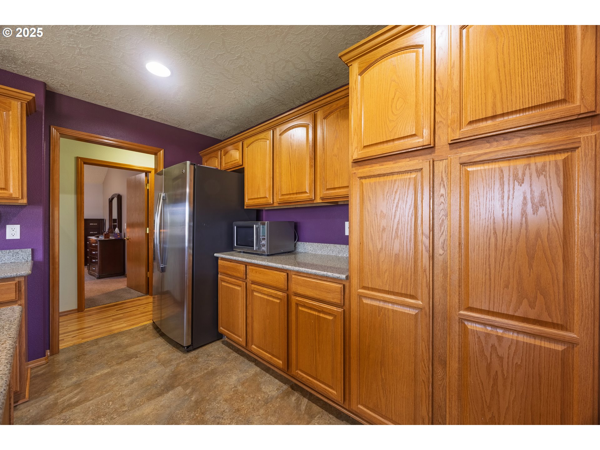 788 Southeast Meadows Loop Sheridan, OR 97378 - Photo 17 of 45 a kitchen with stainless steel appliances granite countertop cabinets and a refrigerator