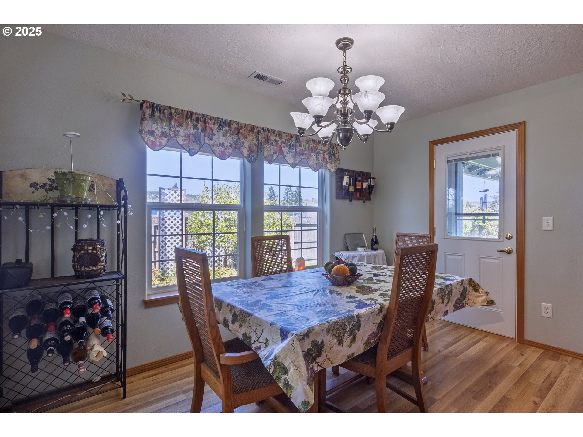 788 Southeast Meadows Loop Sheridan, OR 97378 - Photo 18 of 45 a view of a dining room with furniture window and wooden floor