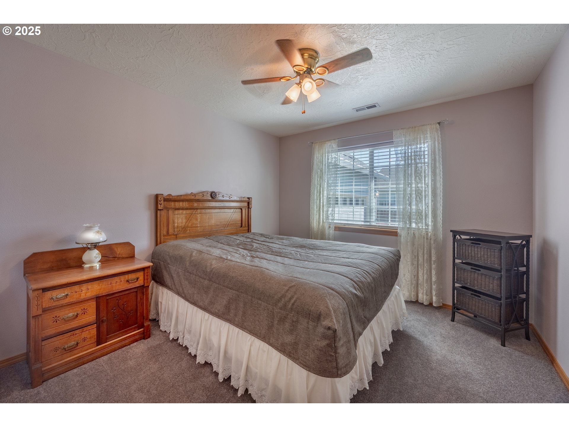 788 Southeast Meadows Loop Sheridan, OR 97378 - Photo 25 of 45 a bedroom with a bed and a dresser
