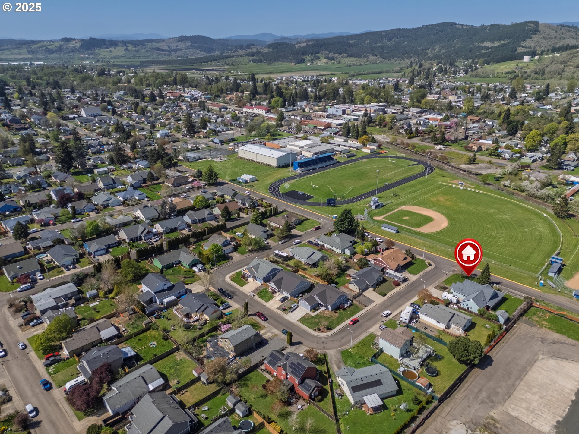 788 Southeast Meadows Loop Sheridan, OR 97378 - Photo 35 of 45 an aerial view of a city with lots of residential buildings