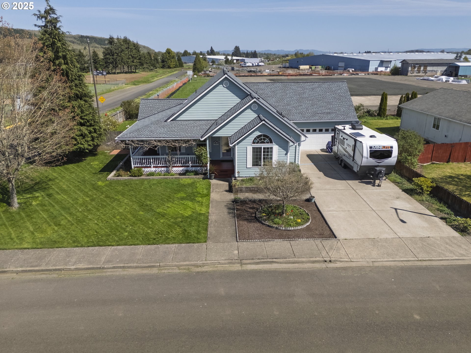 788 Southeast Meadows Loop Sheridan, OR 97378 - Photo 6 of 45 an aerial view of a house with a garden and lake view
