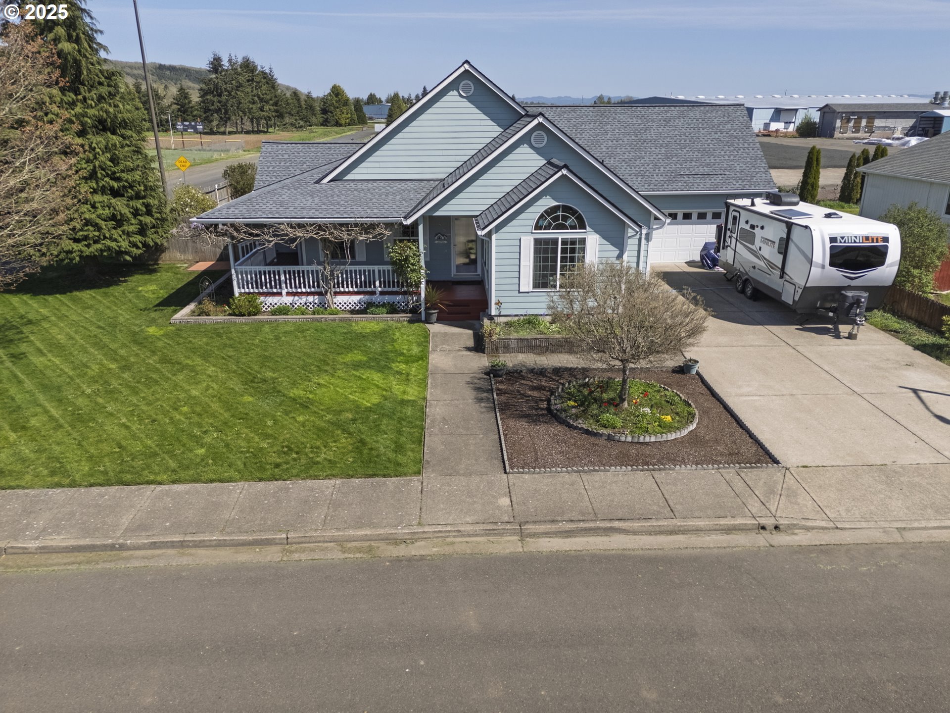 788 Southeast Meadows Loop Sheridan, OR 97378 - Photo 7 of 45 a front view of a house with a garden
