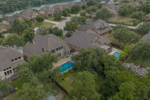 an aerial view of a house with a yard