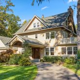 a front view of a house with a yard and porch