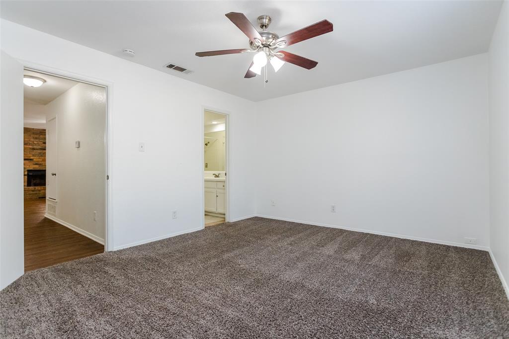 900 Milby Road Arlington, TX 76013 - Photo 16 of 28 an empty room with closet and a chandelier fan