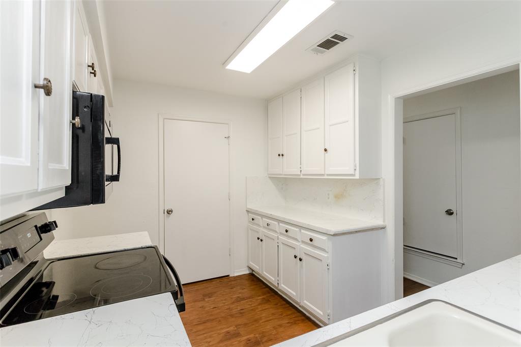 900 Milby Road Arlington, TX 76013 - Photo 20 of 28 a kitchen with a sink and a stove