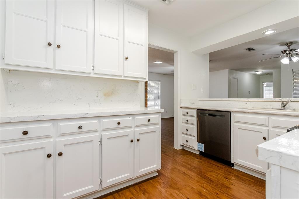 900 Milby Road Arlington, TX 76013 - Photo 23 of 28 a kitchen with white cabinets and white appliances