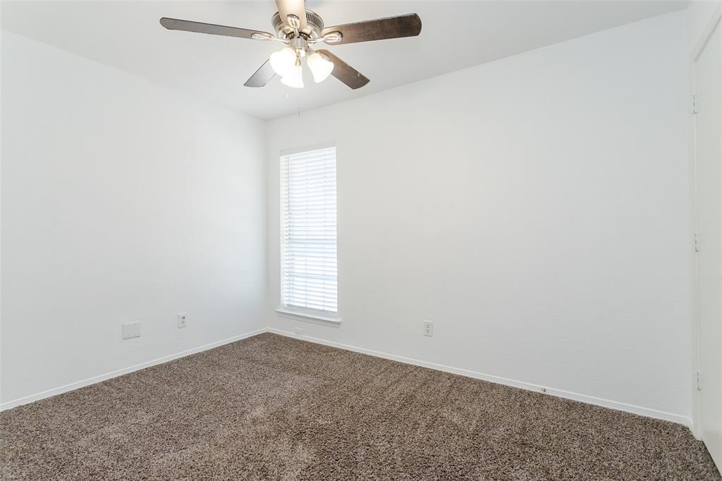 900 Milby Road Arlington, TX 76013 - Photo 24 of 28 an empty room with windows and fan