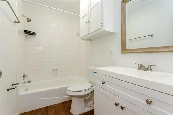 a bathroom with a sink a toilet and a bathtub