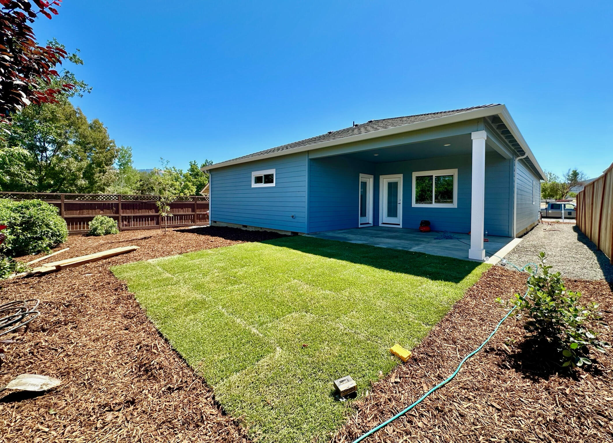 281 Autumn Ridge Road Talent, OR 97540 - Photo 28 of 39 a view of a backyard with a garden and plants