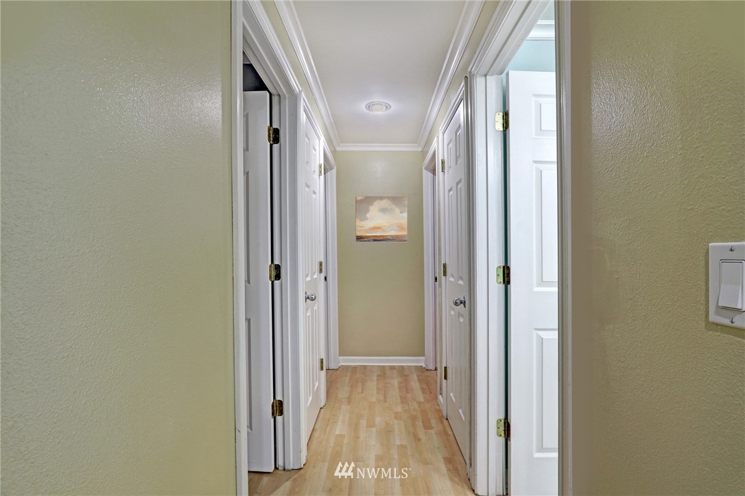 19670 Southeast 139th Place Renton, WA 98059 - Photo 15 of 25 a view of hallway with wooden floor
