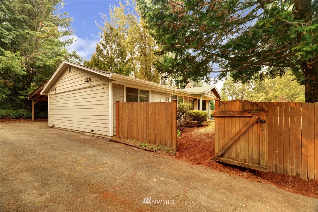 19670 Southeast 139th Place Renton, WA 98059 - Photo 5 of 25 a view of a house with a yard and wooden fence