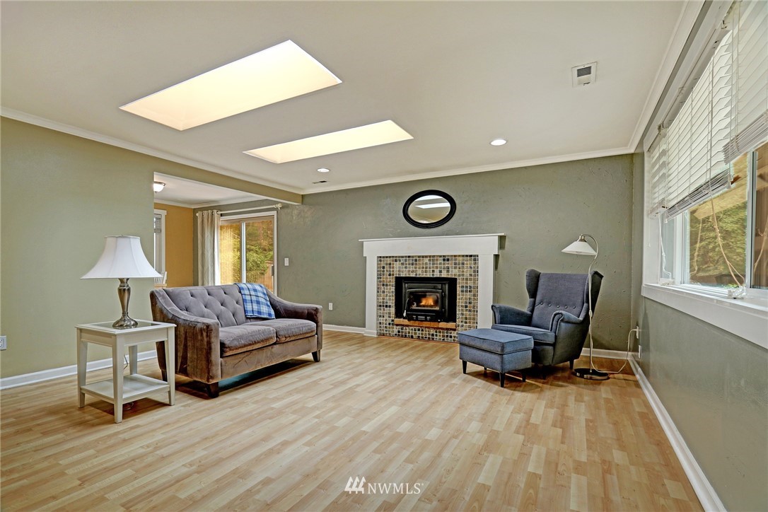 19670 Southeast 139th Place Renton, WA 98059 - Photo 6 of 25 a living room with furniture and a fireplace