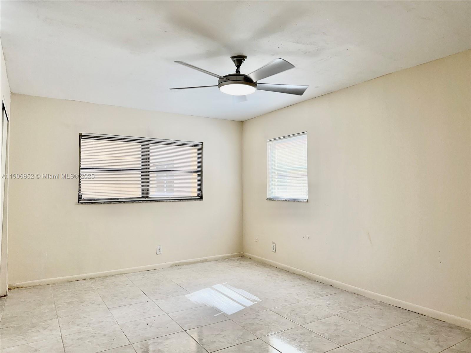 2520 Northeast 1st Court, Unit 204 Boynton Beach, FL 33435 - Photo 11 of 23 a view of an empty room with a window