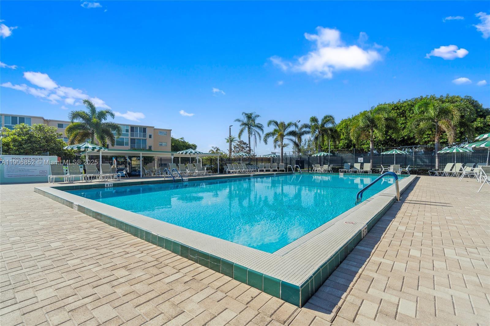 2520 Northeast 1st Court, Unit 204 Boynton Beach, FL 33435 - Photo 16 of 23 a view of a swimming pool and outdoor space