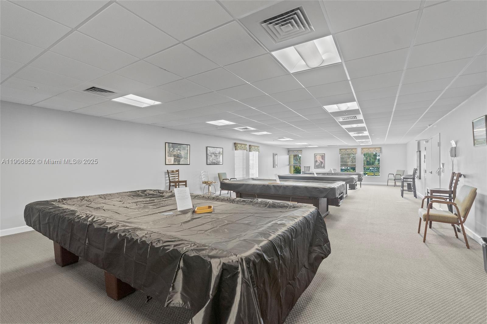 2520 Northeast 1st Court, Unit 204 Boynton Beach, FL 33435 - Photo 18 of 23 a living room with furniture and a table