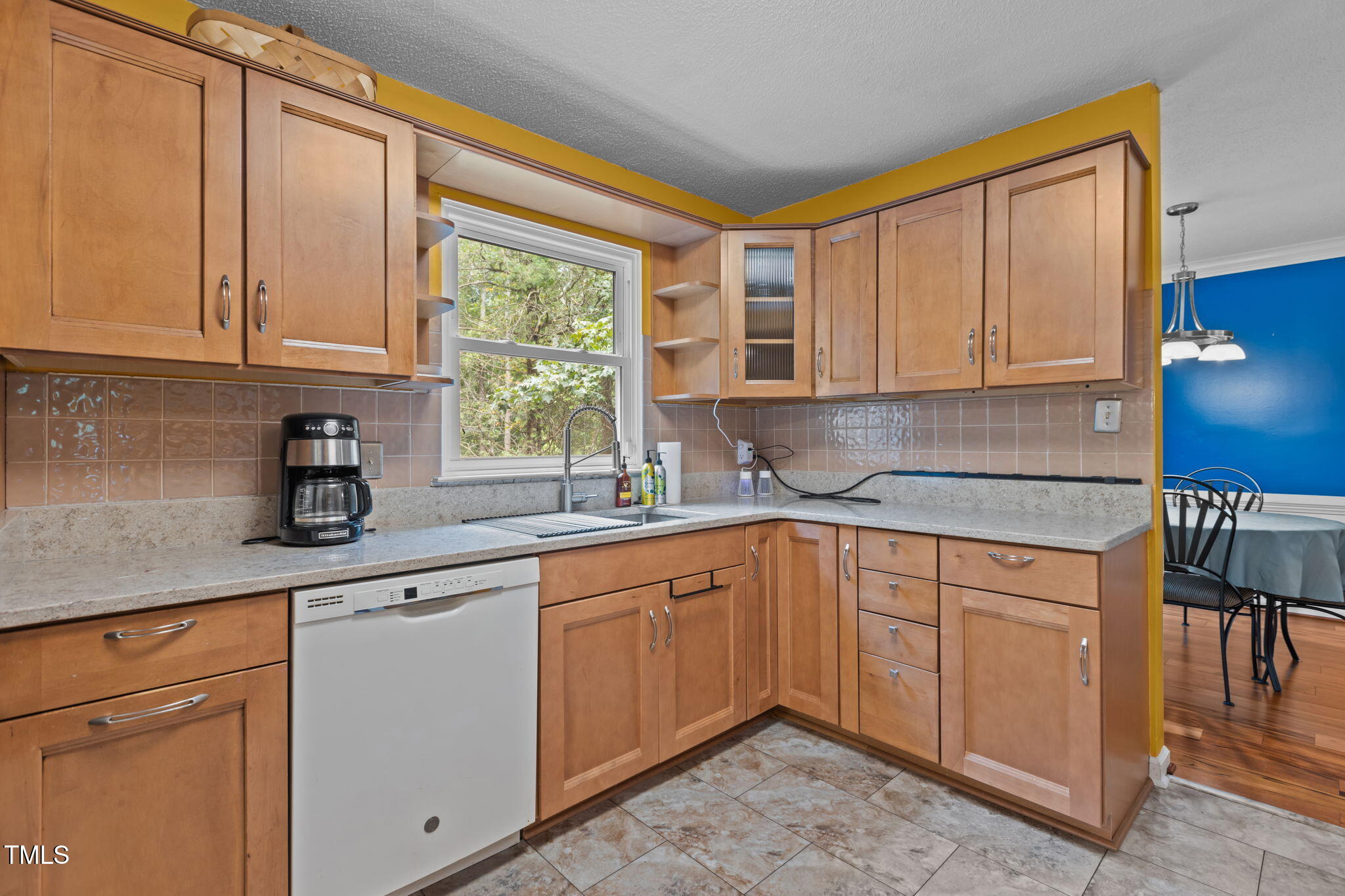 402 Carpenter Fletcher Road Durham, NC 27713 - Photo 17 of 42 a kitchen with stainless steel appliances granite countertop a sink a stove and cabinets