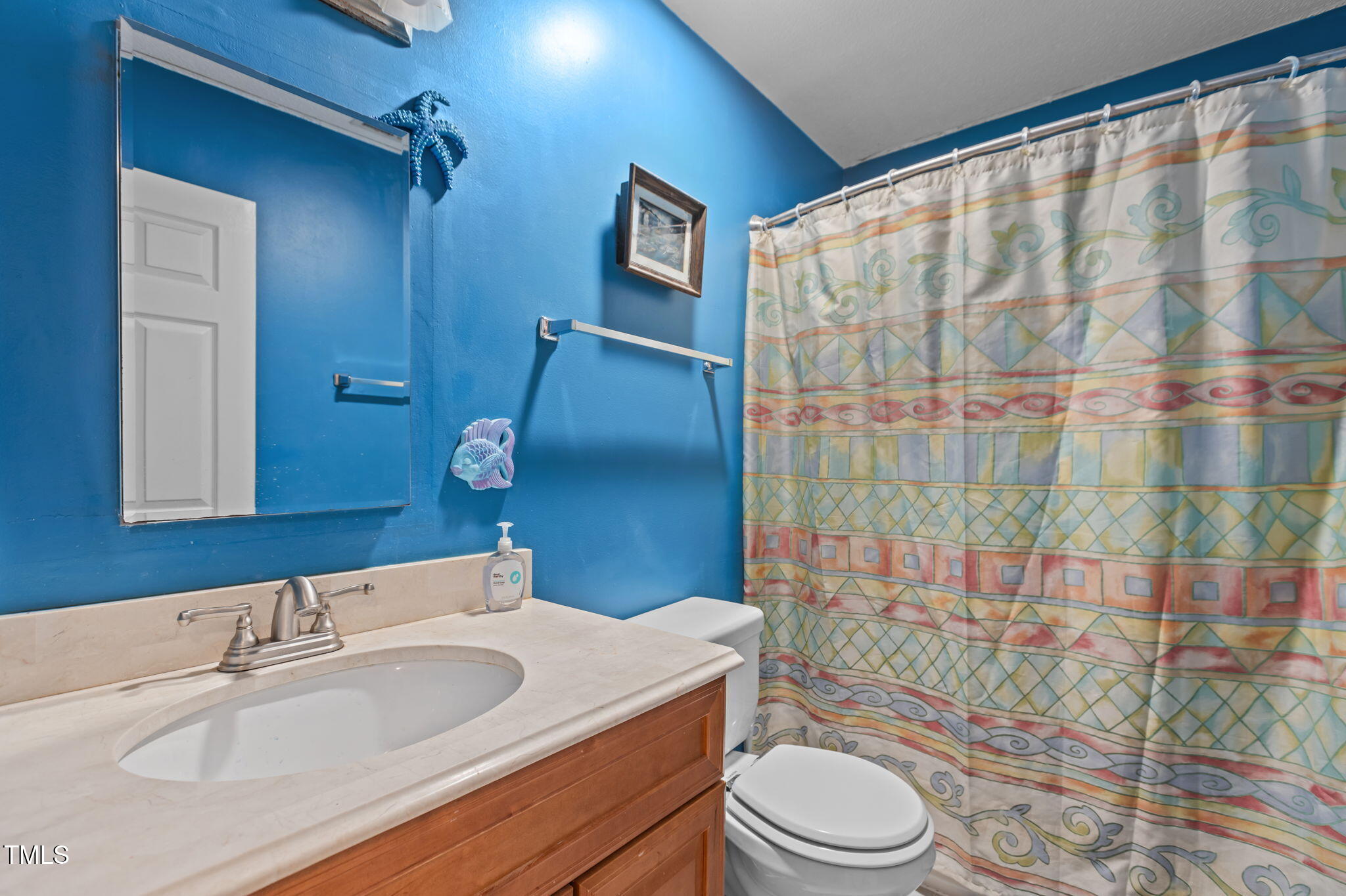 402 Carpenter Fletcher Road Durham, NC 27713 - Photo 34 of 42 a bathroom with a sink toilet and shower