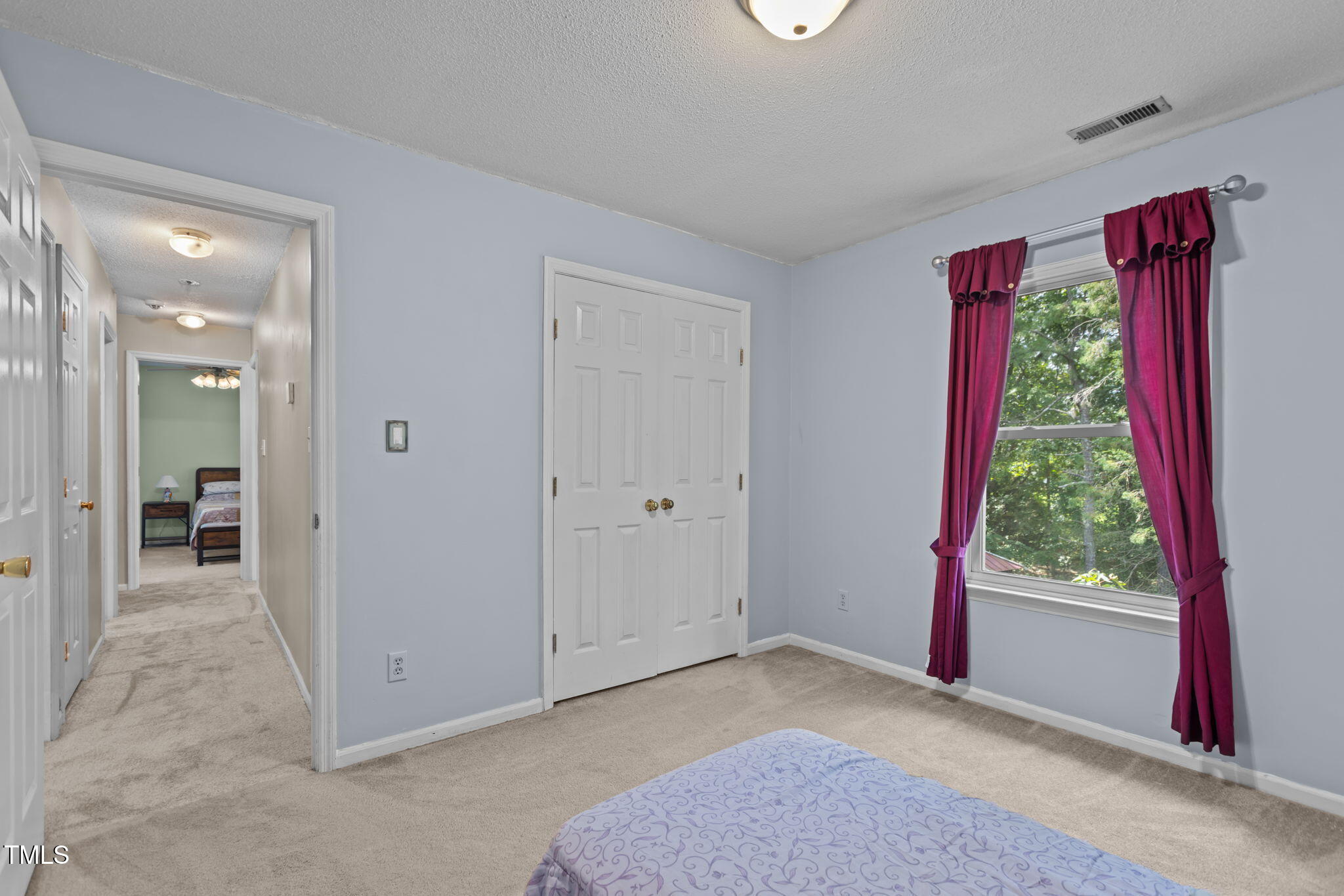 402 Carpenter Fletcher Road Durham, NC 27713 - Photo 36 of 42 a view of a room with window and hallway