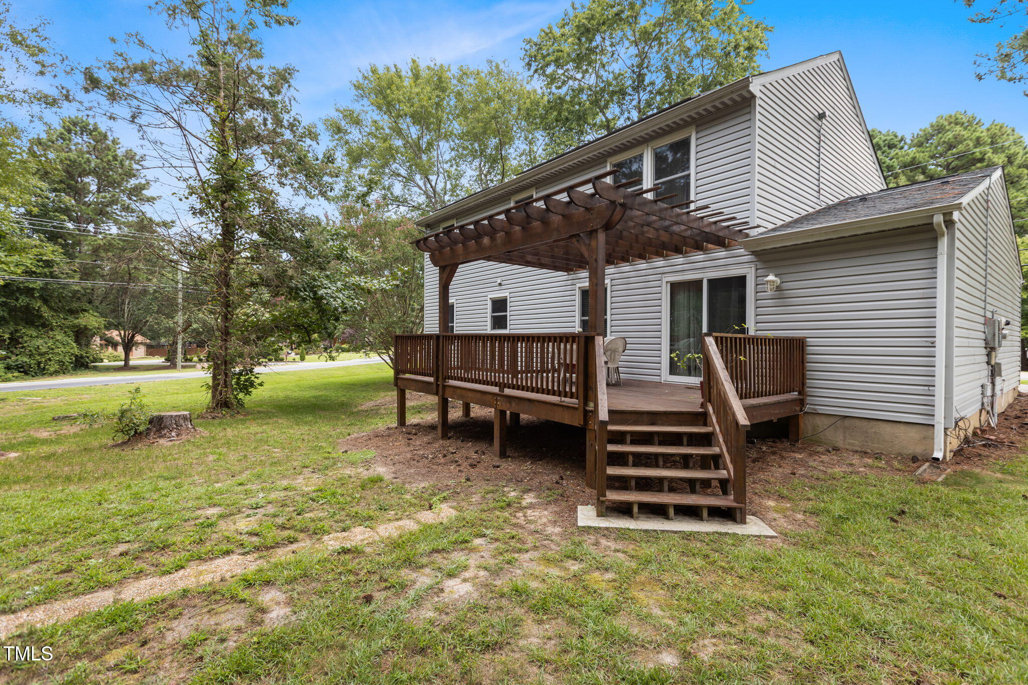 402 Carpenter Fletcher Road Durham, NC 27713 - Photo 5 of 42 a front view of a house with garden