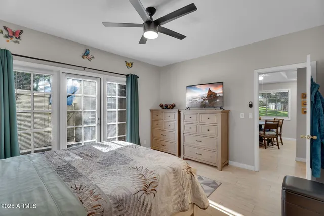 a bedroom with a bed and a dresser