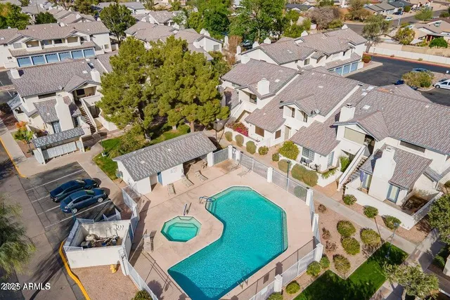 a view of a hallway with a refrigerator
