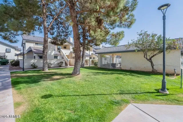 a backyard of a house with lots of green space
