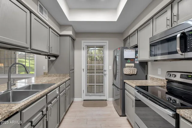 a bathroom with a sink and mirror