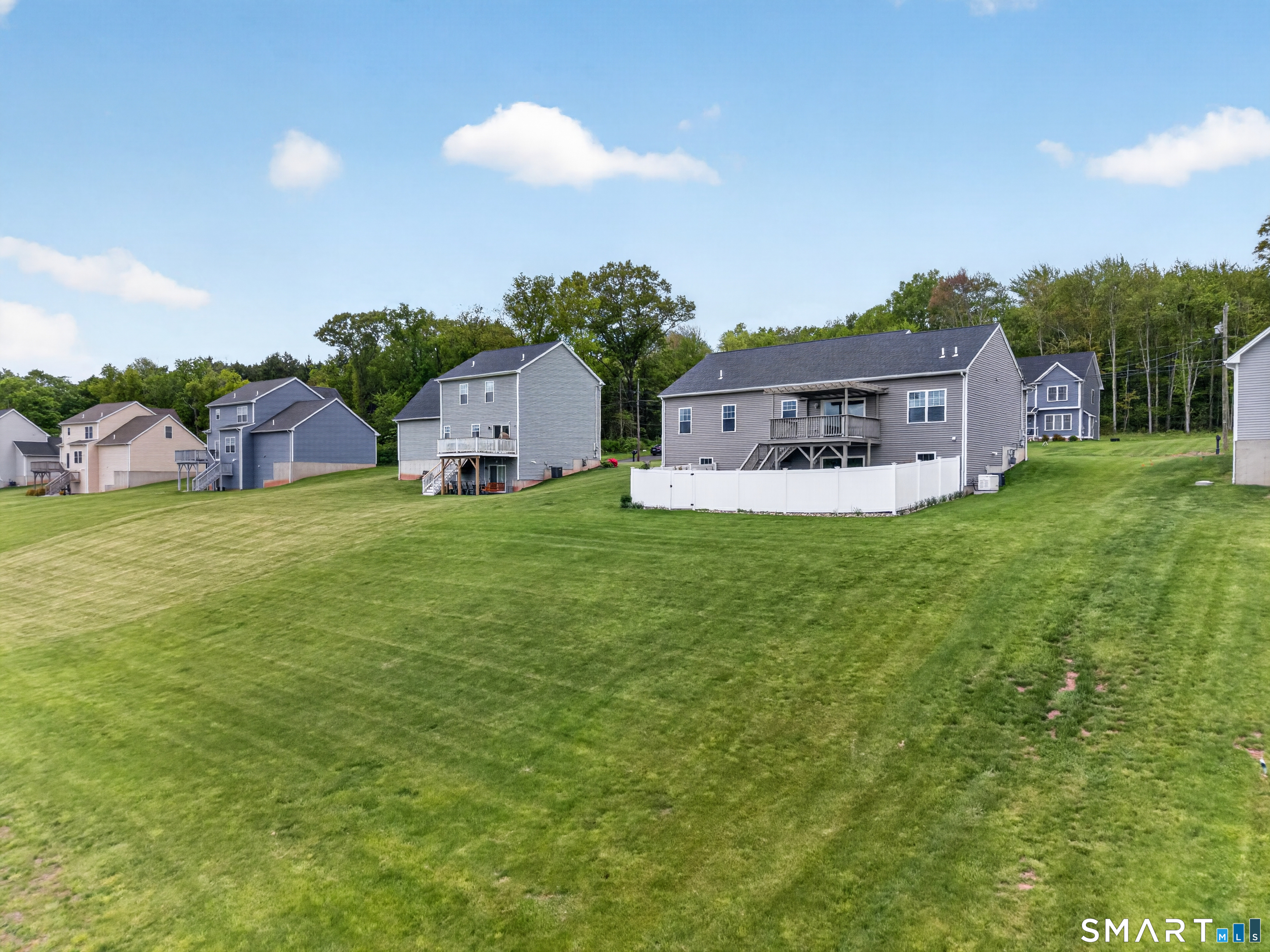 650 Ridgewood Road Middletown, CT 06457 - Photo 33 of 40 a view of a house with a big yard and large trees