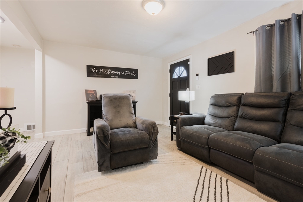 17 Souther Drive Worcester, MA 01602 - Photo 2 of 16 a living room with furniture and a flat screen tv