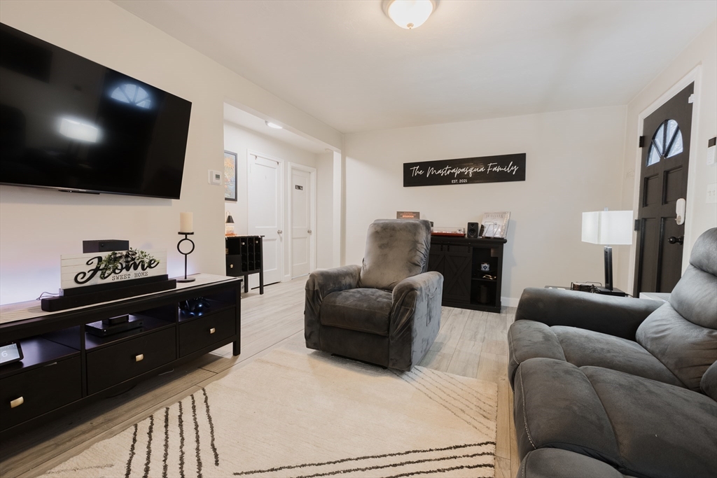 17 Souther Drive Worcester, MA 01602 - Photo 4 of 16 a living room with furniture and a flat screen tv