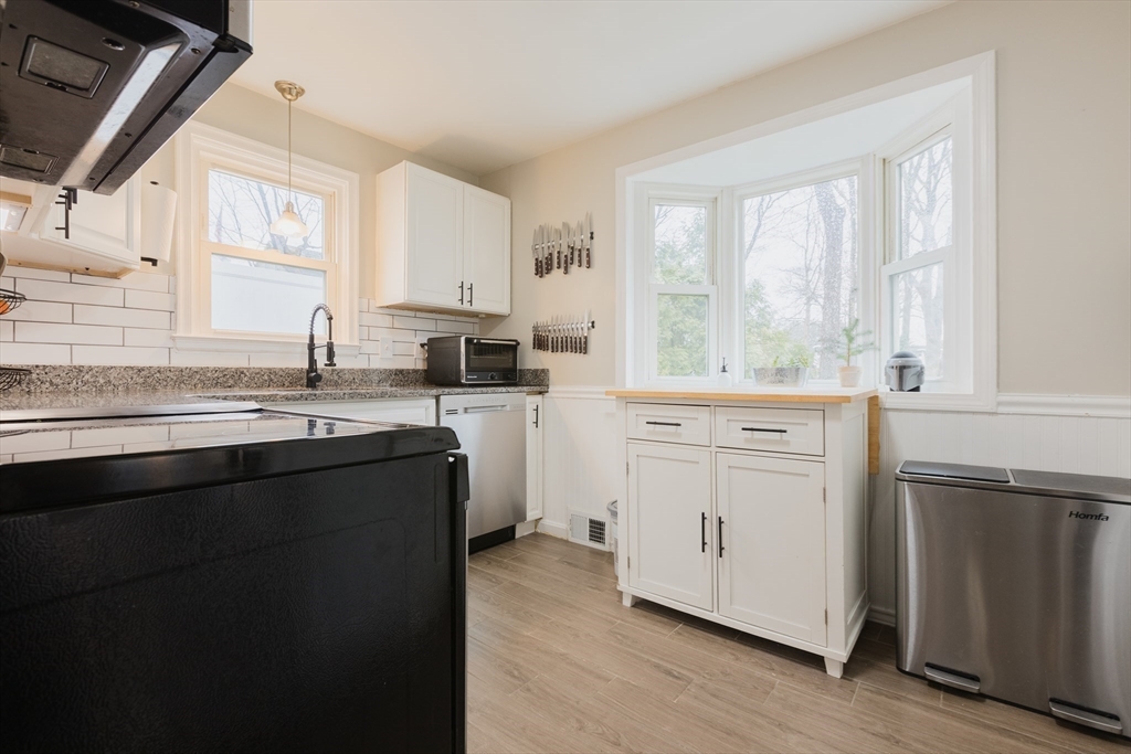 17 Souther Drive Worcester, MA 01602 - Photo 6 of 16 a kitchen with a sink stove and cabinets