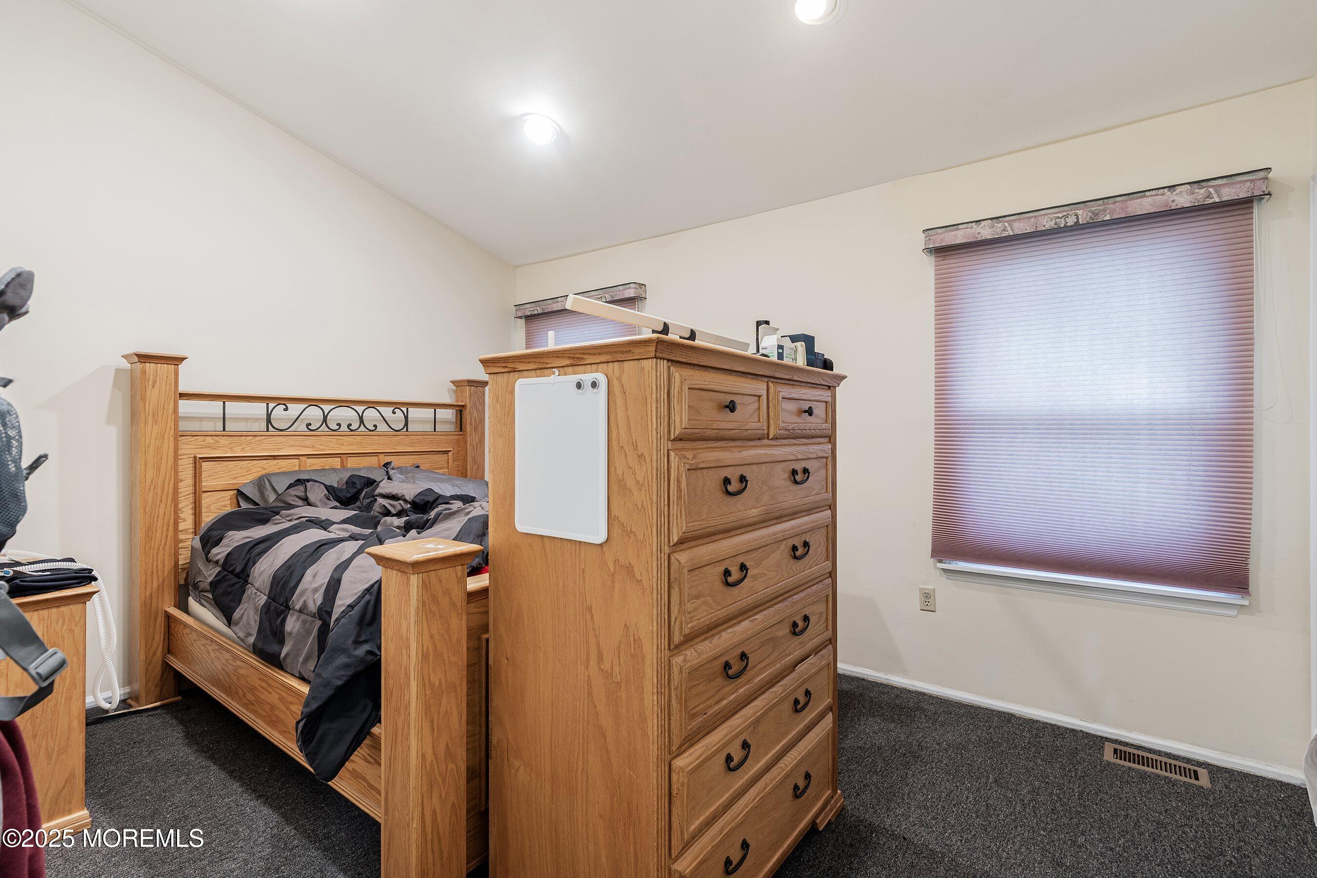 47 Sweet Gum Road Howell, NJ 07731 - Photo 21 of 27 a bedroom with a bed and a mirror