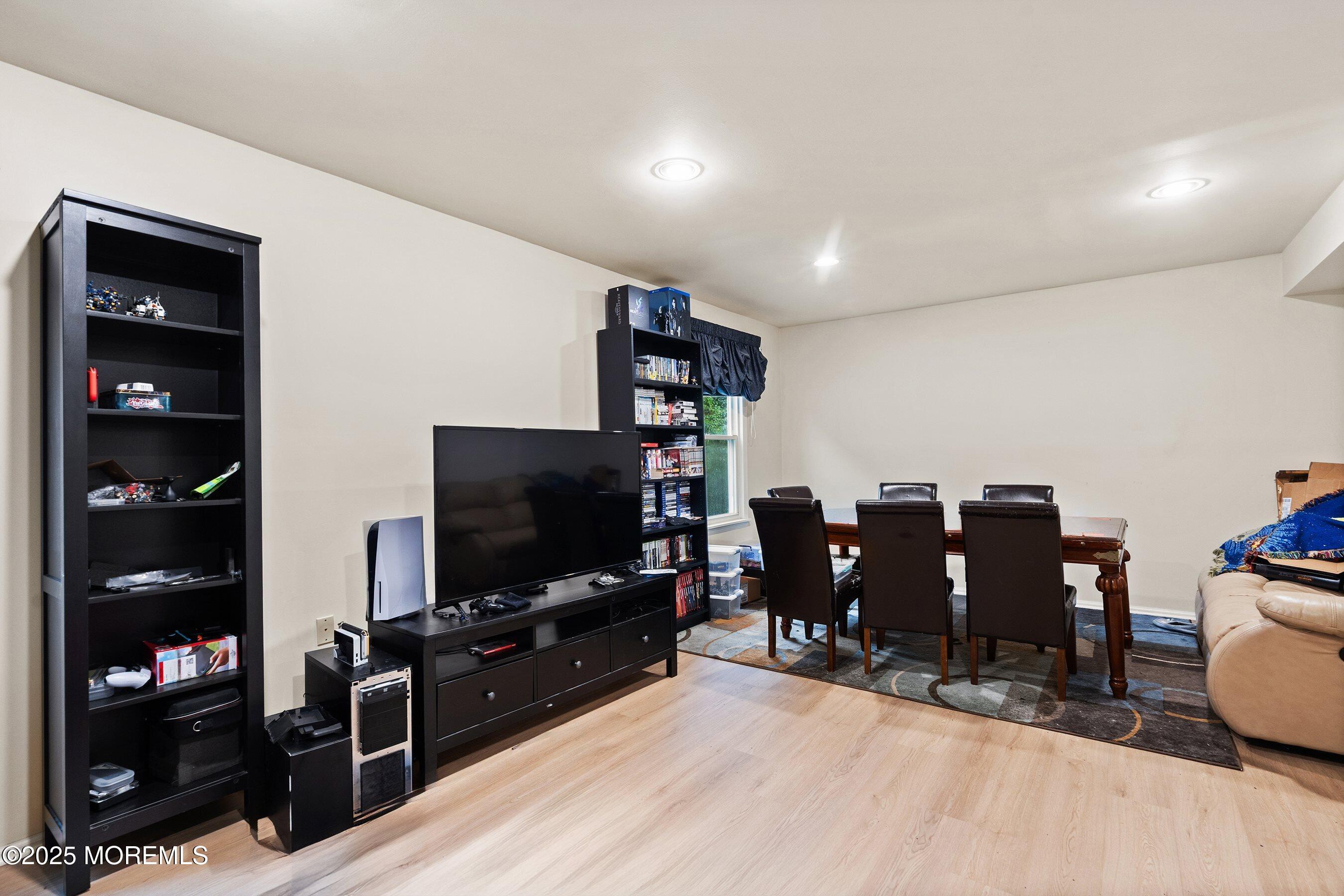 47 Sweet Gum Road Howell, NJ 07731 - Photo 6 of 27 a living room with furniture and a flat screen tv