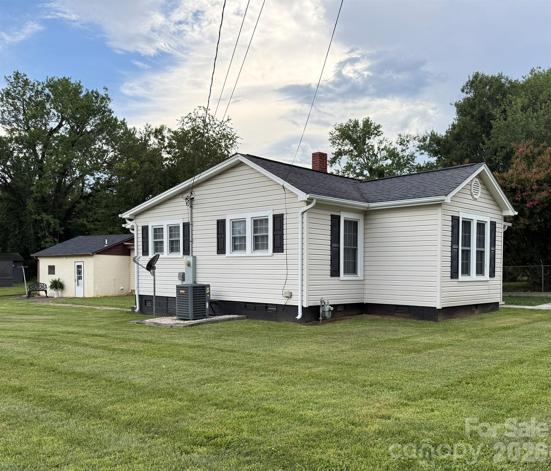 108 Fletcher Street Morganton, NC 28655 - Photo 2 of 29 a front view of a house with a garden