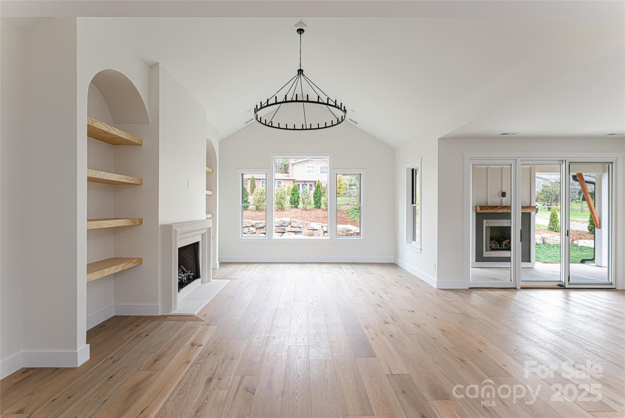 251 Bee Tree Road Swannanoa, NC 28778 - Photo 12 of 46 a view of a room with wooden floor kitchen view and a window