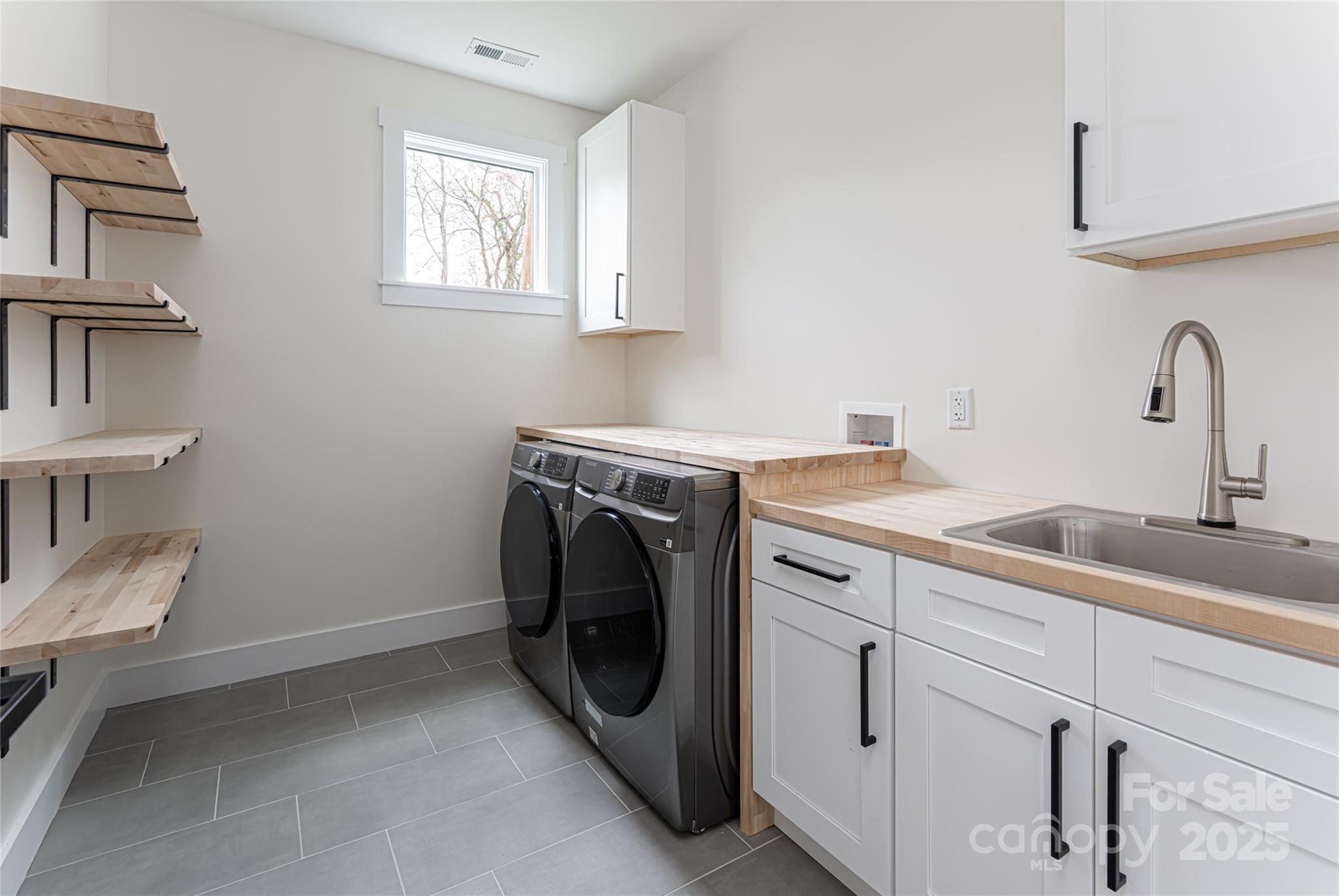 251 Bee Tree Road Swannanoa, NC 28778 - Photo 23 of 46 a utility room with sink dryer and washer