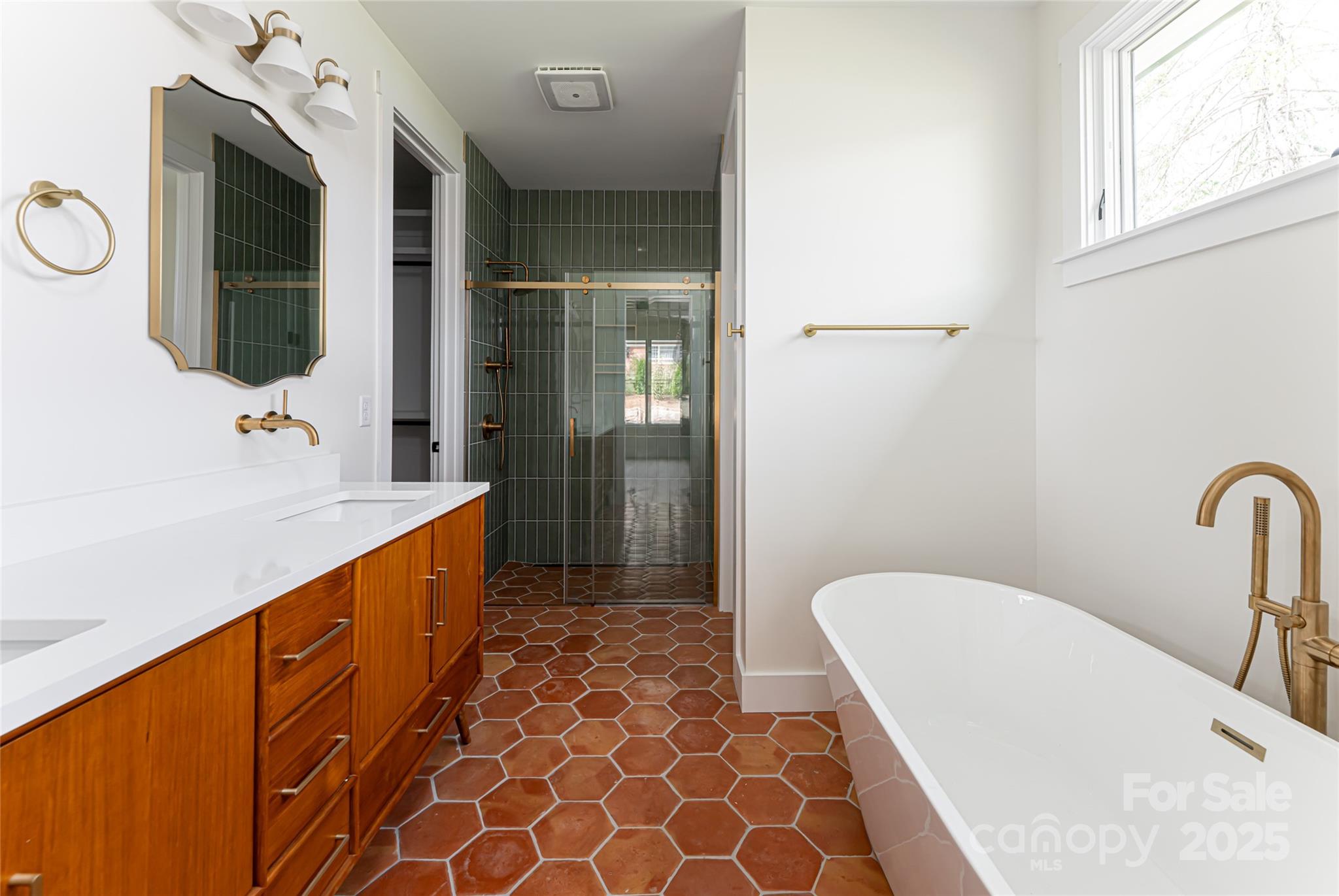 251 Bee Tree Road Swannanoa, NC 28778 - Photo 26 of 46 a bathroom with a sink a mirror and a bathtub