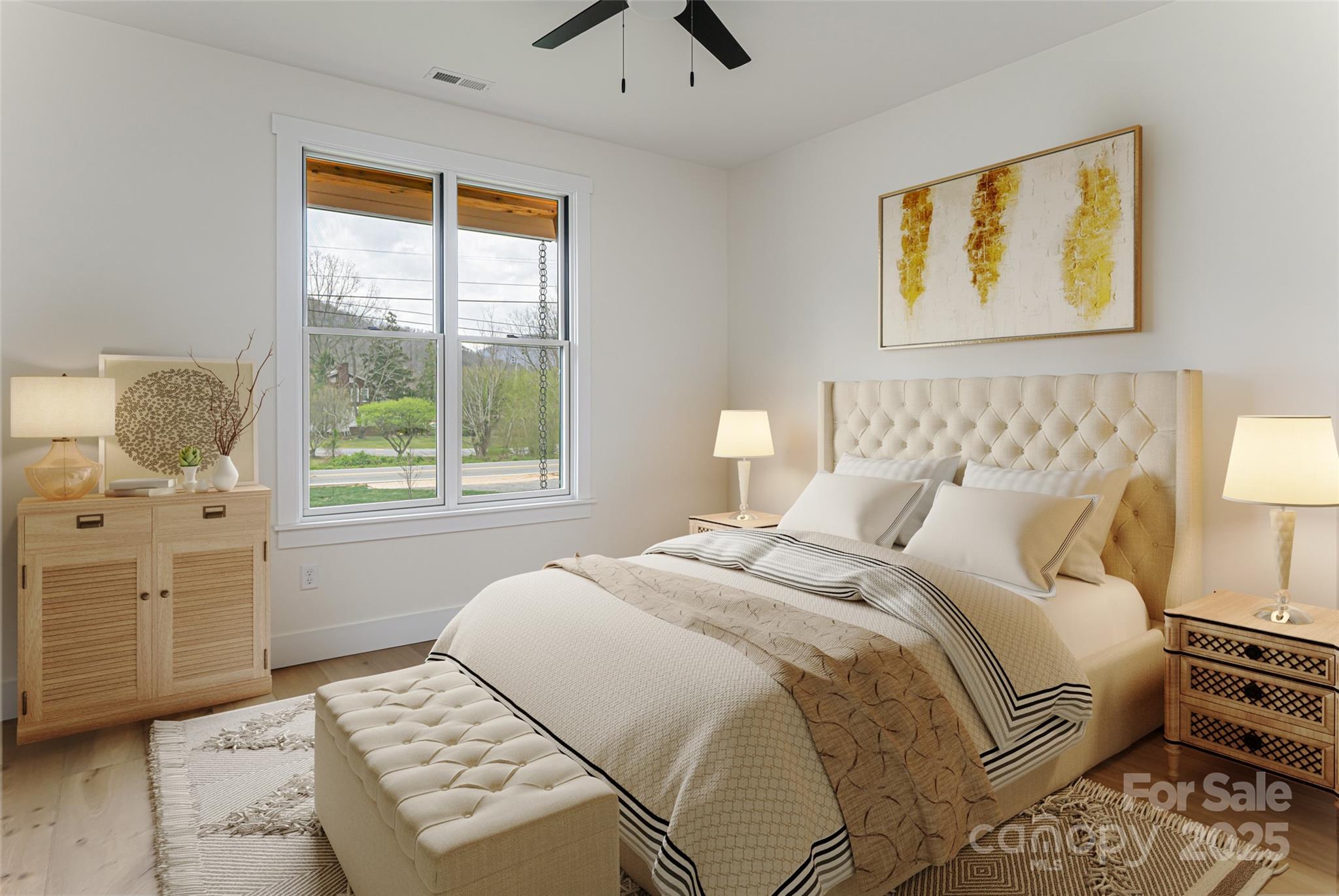 251 Bee Tree Road Swannanoa, NC 28778 - Photo 32 of 46 a bedroom with a bed and wooden floor