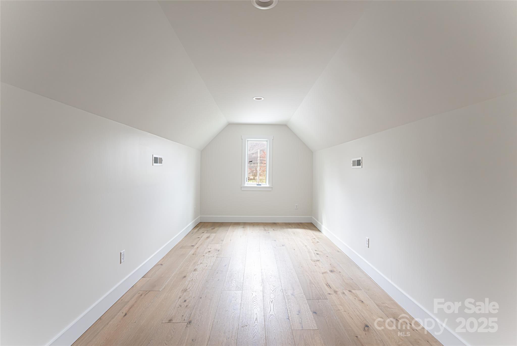 251 Bee Tree Road Swannanoa, NC 28778 - Photo 37 of 46 an empty room with wooden floor and windows