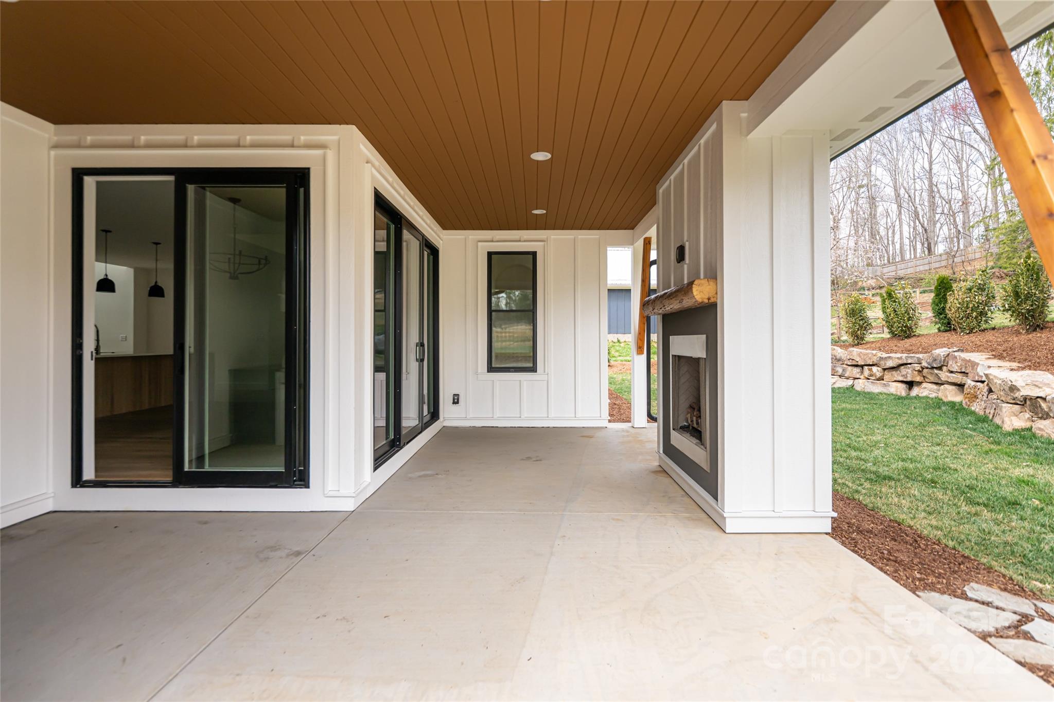 251 Bee Tree Road Swannanoa, NC 28778 - Photo 42 of 46 a view of a porch with a fireplace