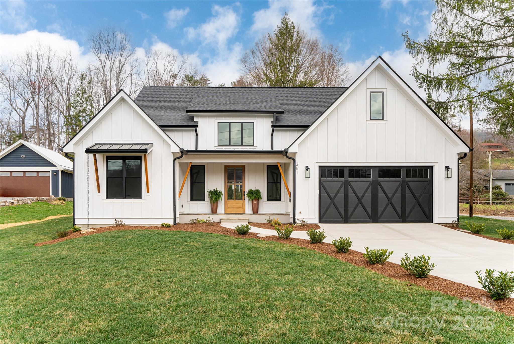 251 Bee Tree Road Swannanoa, NC 28778 - Photo 44 of 46 a front view of a house with a yard outdoor seating and yard