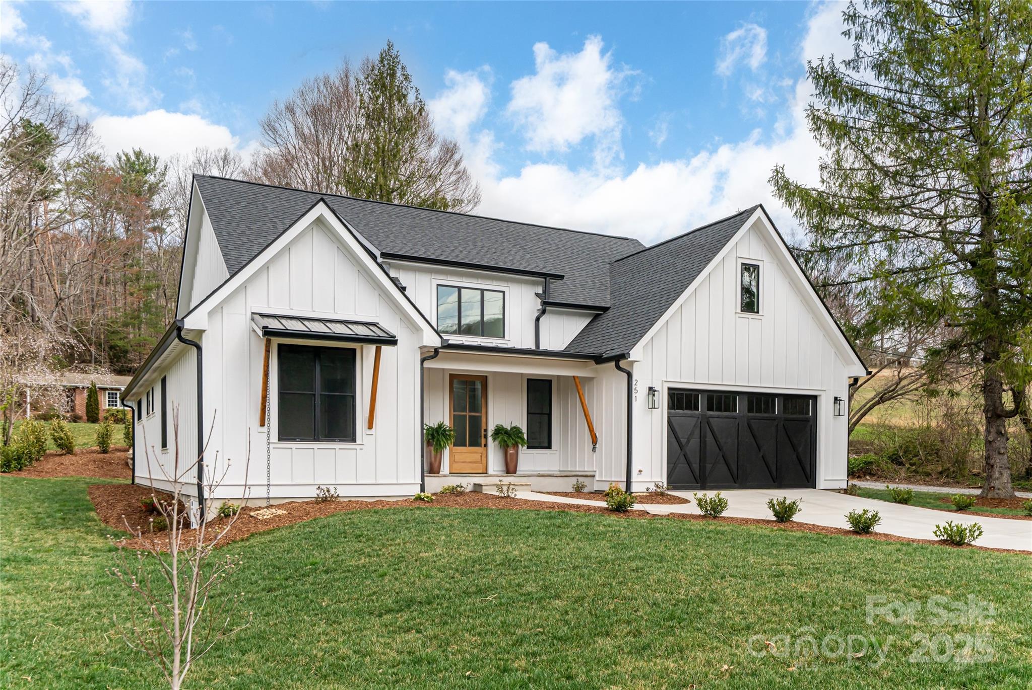 251 Bee Tree Road Swannanoa, NC 28778 - Photo 7 of 46 a front view of a house with a yard