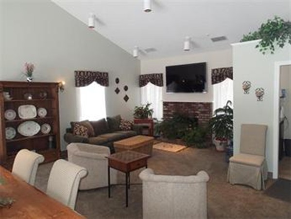 6 Post Oak Lane, Unit 4 Natick, MA 01760 - Photo 16 of 18 a living room with furniture and a flat screen tv
